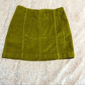 NWOT Mustard colored stretchy mini skirt. Small.